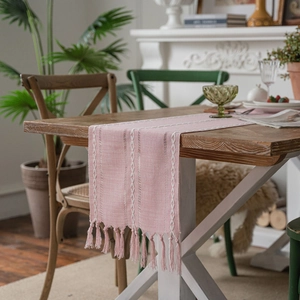Pink bohemian table runner with white geometric embroidery and handmade tassels decor