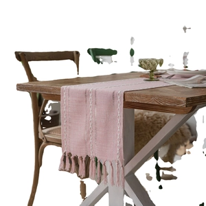 Pink Nordic jacquard table runner with white chain embroidery and handmade tassels