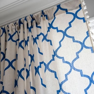 Blue geometric quatrefoil cotton linen curtain with decorative white fringe tassels