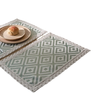 Nordic orange geometric jacquard table runner with fringe and lace borders on white background