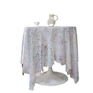 Elegant white lace tablecloth with floral embroidery patterns for elegant home decor