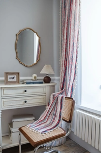 Detail of bohemian striped cotton linen curtain with ethnic patterns and tassels