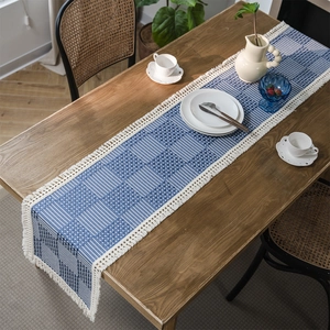 Modern Nordic jacquard geometric table runner with blue checkered pattern and white tassels