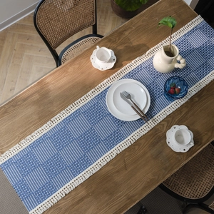 Nordic navy blue jacquard table runner with geometric stripes and white fringe tassels
