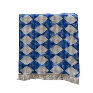 Blue and white argyle woven table runner with decorative beige fringe tassels