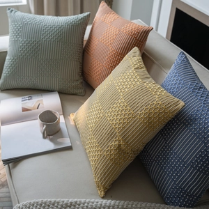 Modern wave jacquard cushions with geometric woven texture on sofa in four colors
