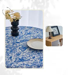 Detail view of retro blue and white jacquard weaving tablecloth with butterfly floral patterns