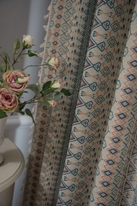 Detail of boho geometric jacquard fabric with fringe tassels for home curtains
