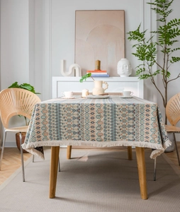 Detail of bohemian geometric pattern and cream fringe edges on the rectangular tablecloth