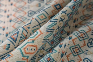 Close-up of thick bohemian jacquard tablecloth with colorful geometric patterns