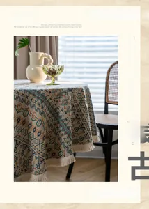 Detailed view of American style tablecloth with geometric patterns and fringe lace edges