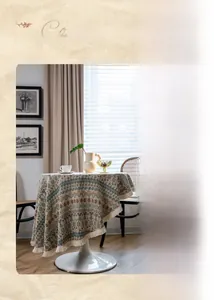 Detail of bohemian geometric jacquard tablecloth with tassel fringe in vintage earth tones