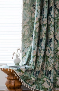 Detail of green floral jacquard fabric with tassels for kitchen cafe curtains