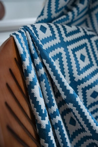 Detailed close-up showing the blue and white geometric woven texture on cotton linen fabric