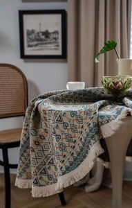 Close-up of geometric pattern on American style thick woven tablecloth with tassel edges