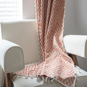 Bohemian style striped knit curtain with orange diamond patterns and white fringe tassels