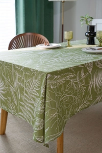 Close-up of green leaf sketch tablecloth with premium cotton linen texture for dining table