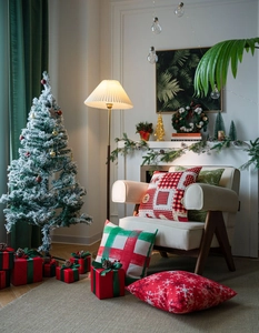 Detailed close-up of festive Christmas cushion covers in red and green holiday patterns