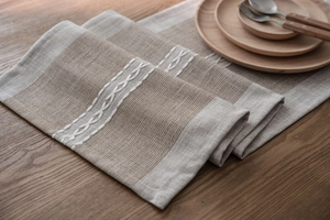 Close-up of geometric white embroidery on Nordic jacquard linen blend table runner