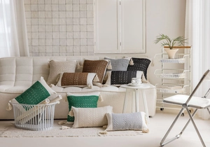 Detailed texture of jacquard knit cushion covers with tassels in various boho colors