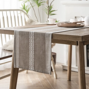 Nordic jacquard geometric table runner with tassels in beige and wood tones