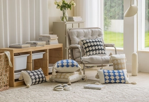Detail of bohemian geometric cushion covers with hand-made tassels and woven texture