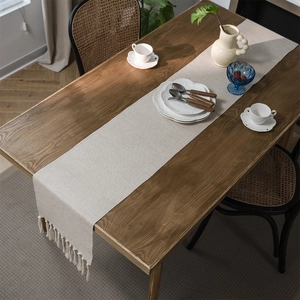 Nordic beige jacquard table runner with tassels on dark wood dining table decor