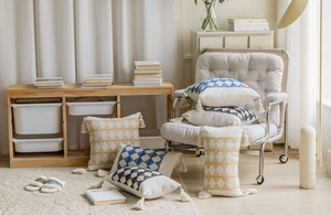 Detail of bohemian jacquard pillowcase with geometric patterns and handmade fringe tassels