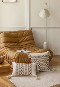 Bohemian jacquard decorative pillow with geometric embroidery and tassels on knit fabric