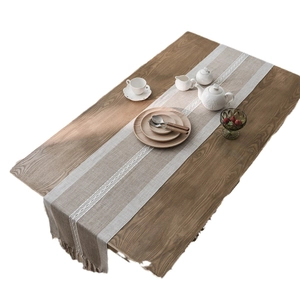 Nordic jacquard geometric table runner with tassels and white woven patterns on wood