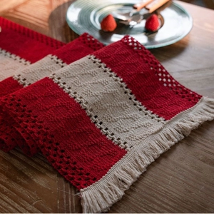 Striped red and white cotton table runner with handmade tassels for festive dining decor