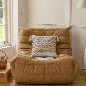 Modern mustard yellow velvet sofa chair with cream geometric embroidered tassel pillow