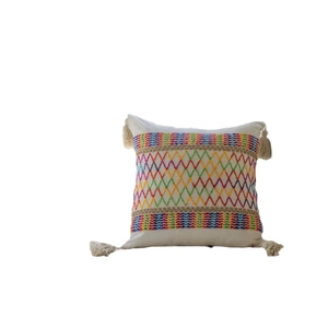 Bohemian style square pillow with colorful geometric embroidery and corner tassels