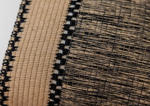 Macro detail of bohemian jacquard woven fabric showing intricate texture and fiber patterns