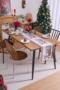 Christmas gnome table runner on a dining table with festive holiday home decorations