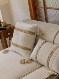 Detailed knit rhombus texture and decorative tassels on bohemian cotton linen pillowcase