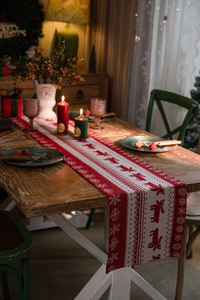 Detailed knit of Christmas table runner featuring reindeer and snowflake patterns