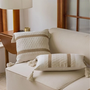 Boho jacquard throw pillows with fringe tassels on a sofa, set of square and lumbar covers