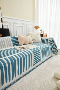 Detailweergave van de Scandinavische geometrische geweven bankhoes met witte franjes
