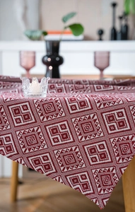 Detailed texture of red and white geometric jacquard woven rectangular tablecloth