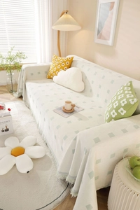 Modern cream chenille sofa cover with green checkerboard patterns and fringe details