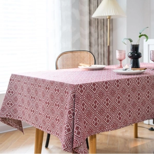 Rectangular red table cloth with geometric jacquard pattern and boho fringe tassels