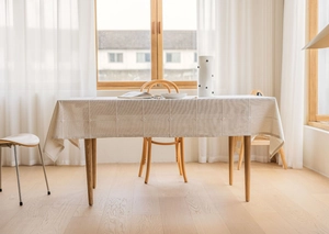 Detail of beige plaid tablecloth with cotton linen texture and 3D embroidery accents