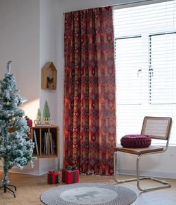 Detail shot of bohemian festive red jacquard curtain with elegant white side tassels