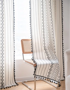 Bohemian black and white geometric print curtain with delicate fringe tassels detail