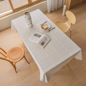 Minimalist beige checkered linen tablecloth with quilted texture for dining decor