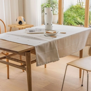 Linen textured plaid tablecloth in beige with minimalist waffle pattern for modern home decor