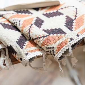 Jacquard tassel curtain with geometric Southwestern pattern in cream and orange