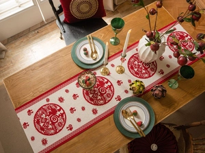 Close-up of festive red Fu character pattern on beige jacquard fabric table runner