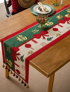 Detail of red festive table runner with golden Fu character and tassels for Lunar New Year